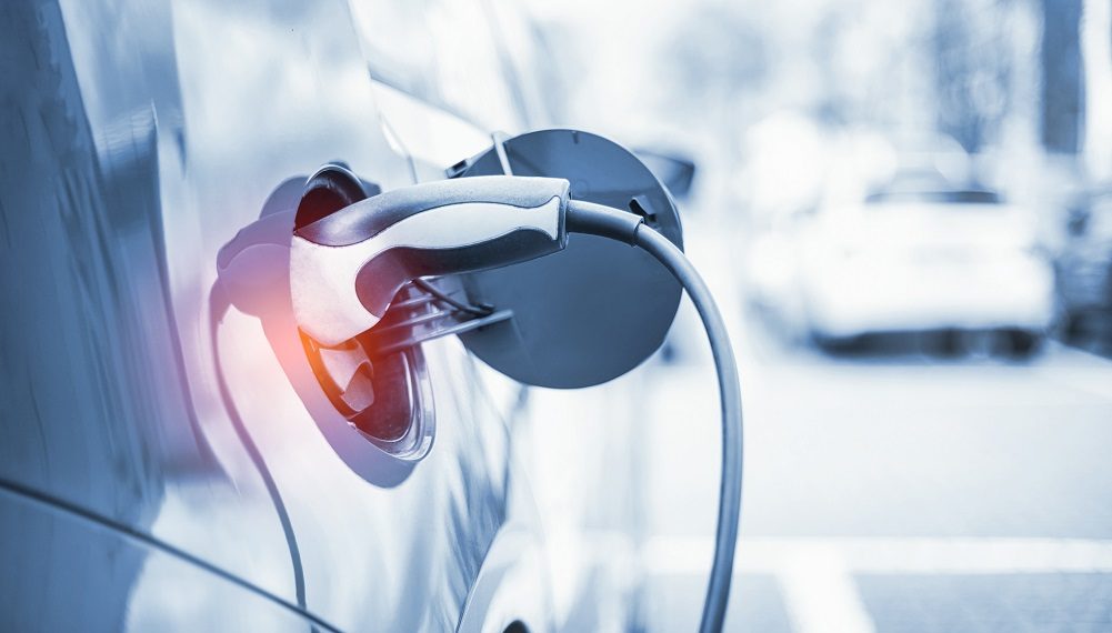 Electric Car Charging At Power Station
