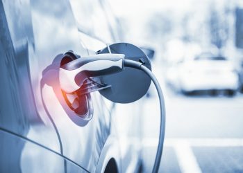 Electric Car Charging At Power Station