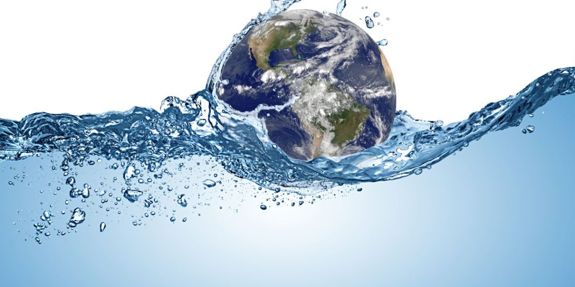 planet earth globe in wave of water in the ocean. Climate change