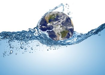 planet earth globe in wave of water in the ocean. Climate change