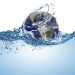 planet earth globe in wave of water in the ocean. Climate change