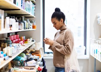 Young African woman shopping in zero waste store