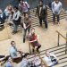 Portrait of university students standing together on staircase